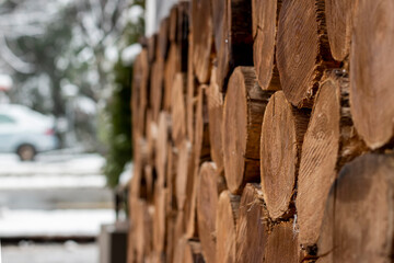 Chopped   stacked firewood in a log. in the backyard.