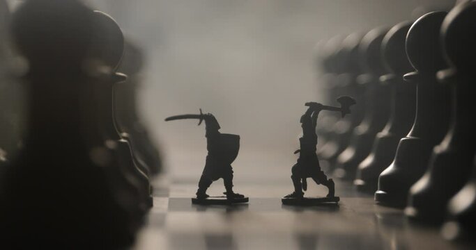 Medieval battle scene with cavalry and infantry on chessboard. Chess board game concept of business ideas and competition and strategy ideas Chess figures on a dark background with smoke and fog.