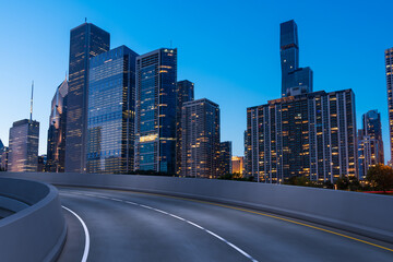 Empty urban asphalt road exterior with city buildings background. New modern highway concrete construction. Concept of way to success. Transportation logistic industry fast delivery. Chicago. USA.