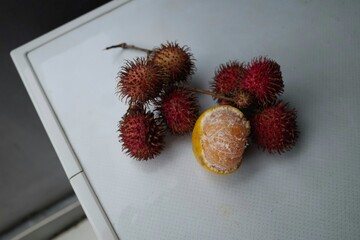 rambutan fruit is red and tastes sweet