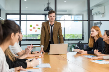 Diverse colleagues gather in brainstorm discuss statistics together. Group of people colleagues gather doing Brainstorming business plan together. Team Brainstorm Working Concept.
