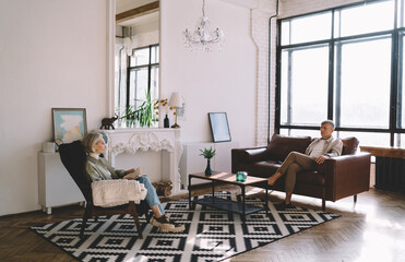 Senior couple resting in living room