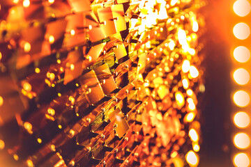 Colourful sequins with light shining colourful background.