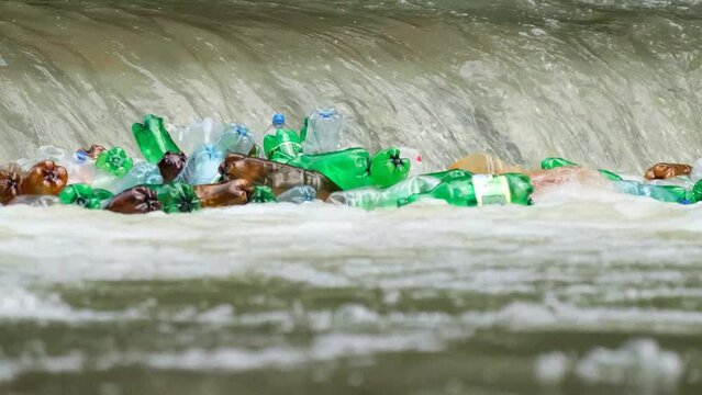 Pollution of water through plastic bags, bottles and other garbage dumped directly into the river