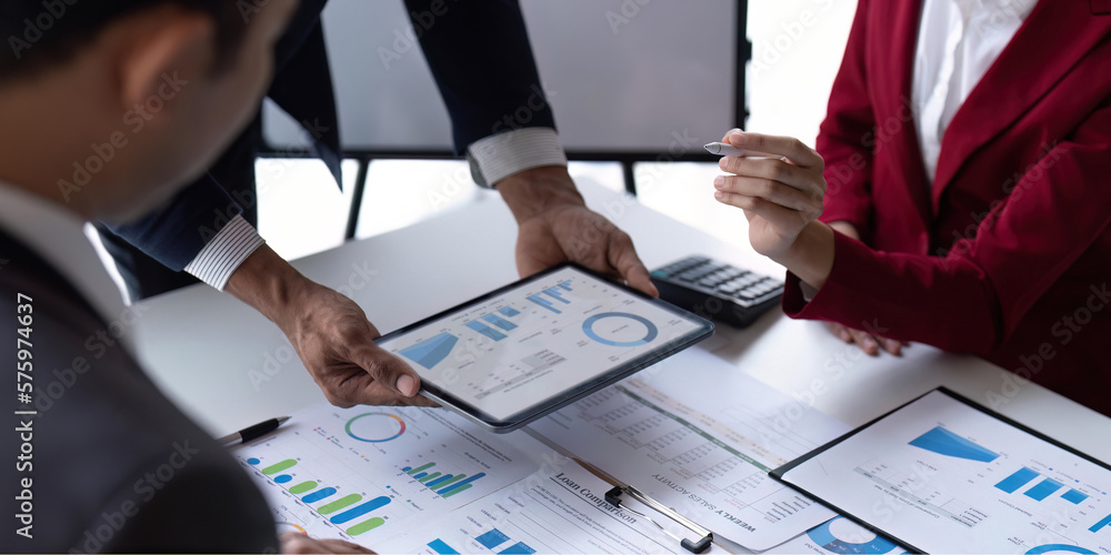 Poster businessmen team or financial data analysts working with tablets data graphs together. plan to analy