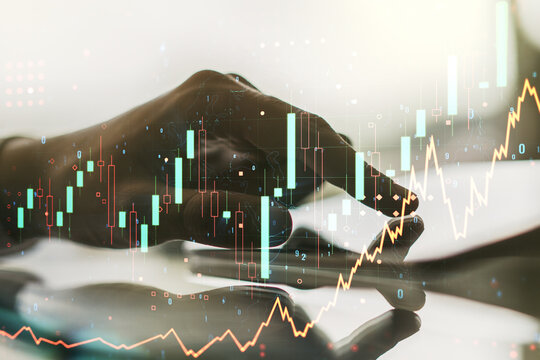 Multi exposure of abstract creative financial graph with finger presses on a digital tablet on background, forex and investment concept