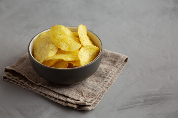 Homemade Potato Chips with Yogurt and Herbs Flavour. Space for text.