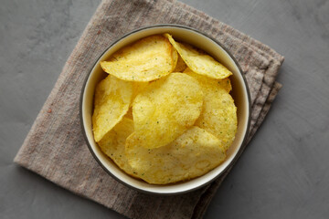 Homemade Potato Chips with Yogurt and Herbs Flavour, top view. Overhead, from above, flat lay.