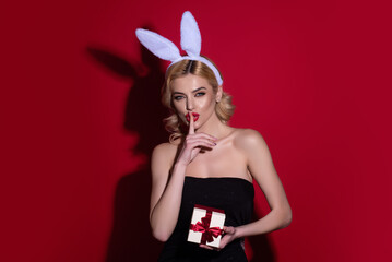 Portrait of a sexy girl celebrating easter isolated over studio background. Studio photo of a young...