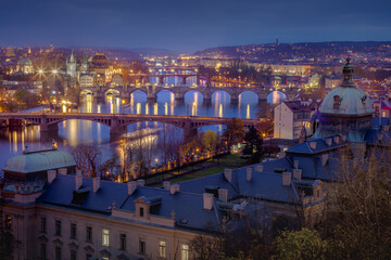 Fototapeta premium Panoramic view over the cityscape of Prague at dramatic dusk, Czech Republic