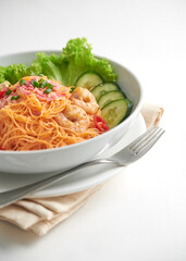 Fried tomyum Bihun (Mee siam) isolated on white background , shrimp and Rice vermicelli stir fried