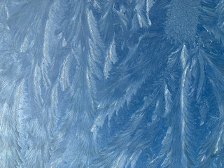 Fototapeta na wymiar Hoar frost on glass, abstract natural pattern