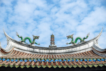Fototapeta na wymiar Dragon statues on the roof of the God of War Temple in Tainan, Taiwan.
