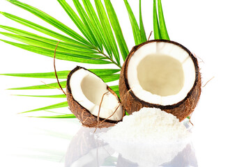 Coconut slice. Coco pieces isolated on white. Coconut with leaves.