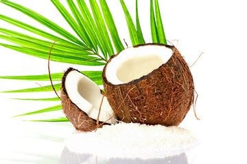 Coconut slice. Coco pieces isolated on white. Coconut with leaves.