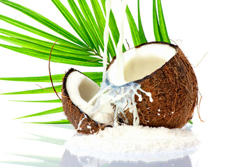 Coconut slice. Coco pieces isolated on white. Coconut with leaves.