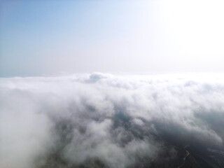 Flying above the clouds on drone.Drone soars through thick clouds, revealing majestic mountain silhouettes. Calp, Alicante, Spain