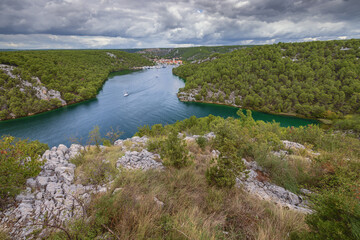 Fototapeta na wymiar The mouth of the Krka River with Skradin in a distance