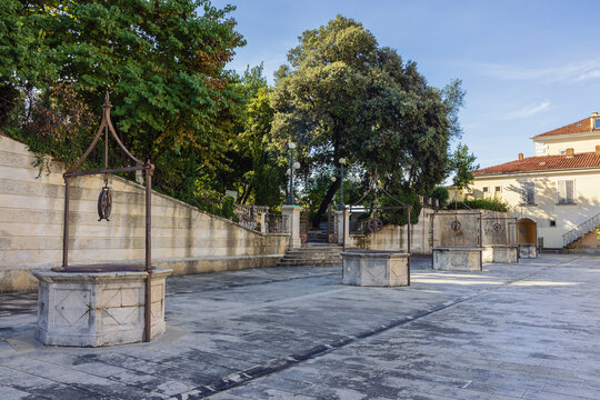 View of Five Wells Square with five wells lined up one after the other, giving the square a very unique and interesting look.