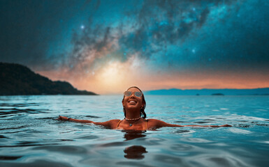 beautiful young woman submerged in water up to her neck happy smiling relaxed with open arms with...