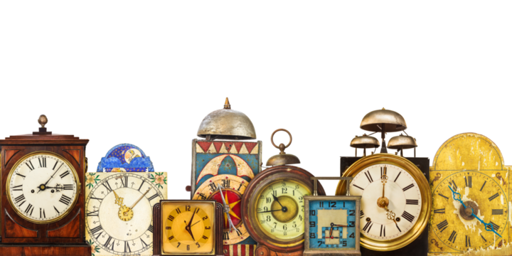 Collection of different vintage table clocks in a row