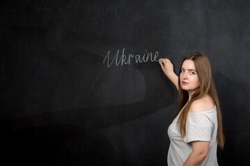 a girl of European appearance writes 