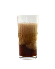 Effervescent drink with foam in a transparent glass isolated on a white background