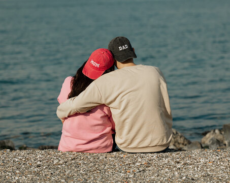New baby coming. Pregnancy announcement. Happy couple hugging. 