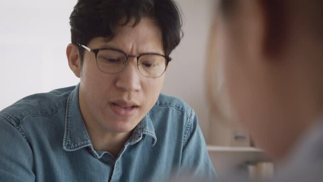 Bad CEO boss work argue point face stress rude yelling anger hate speech at female coworker. Two adult asia people man woman fight on meeting at office upset mad bossy male worker. Career job issue.