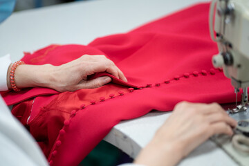 Woman sewing in an atelier