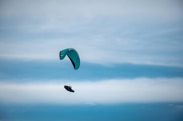 man flying on a hang gliding