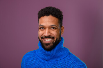 Obraz premium Portrait of happy multiracial man in knitted sweater.