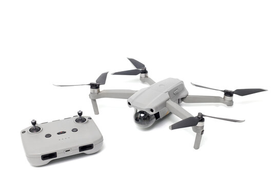 Drone  and remote control isolated on white background.