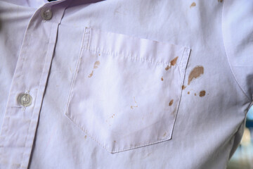 chocolate stain on white shirt of kid from eating in daily life for cleaning concept idea