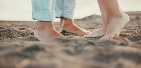 Fototapeta na wymiar Couple feet kissing and loving concept. Outdoor leisure activity. Relationship boy and girl in summer at the beach. People enjoying sand and nature. Barefoot man and woman unrecognizable. Romance
