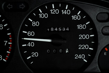 50 kilometers speed on a car speedometer. Speedometer with needle displaying 50. Close-up. Speed limit concept