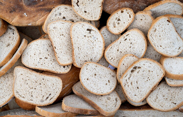 Pieces of dry white bread arranged evenly.