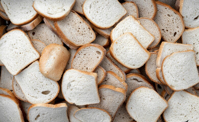 Pieces of dry white bread arranged evenly.