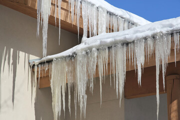 icicles and snow on a roof