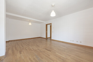 Fototapeta na wymiar Empty room in a house with an oak floor, a dressing area and a toilet with a cream marble top