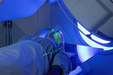 Woman receiving Radiotherapy Treatments for cancer.