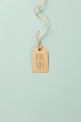 gift tag with text on pastel blue background