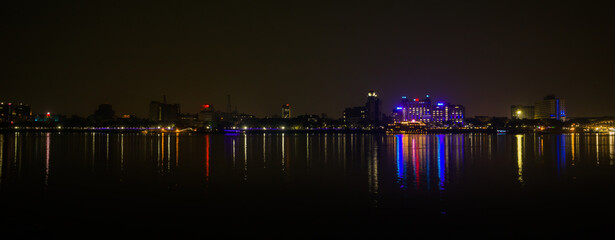 kolkata, west bengal feb 27 2023. Night cityscape of kolkata at night time with hooghly river in...