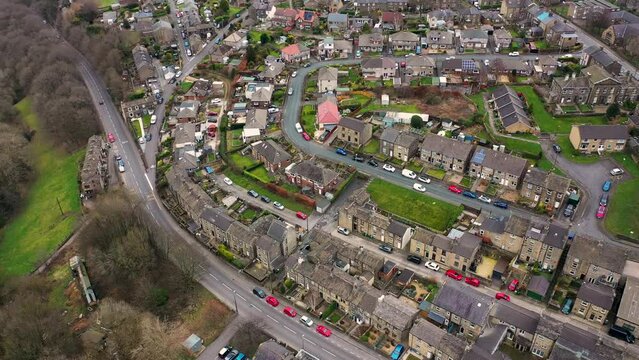 Aerial drone footage of the Village of Netherton near Huddersfield, in the Kirklees metropolitan borough of West Yorkshire, England showing the residential houses in the winter time