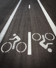 Bicycle lane with markings on asphalt in a city