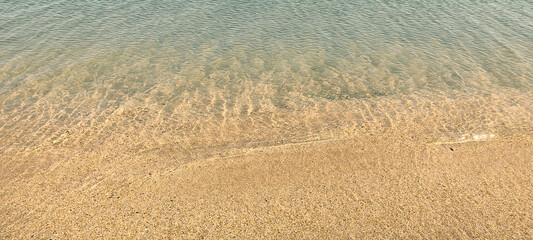 sand and water on a sunny day