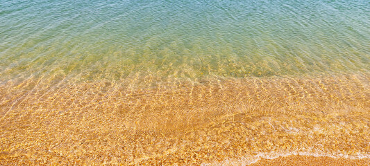 sand and water on a sunny day