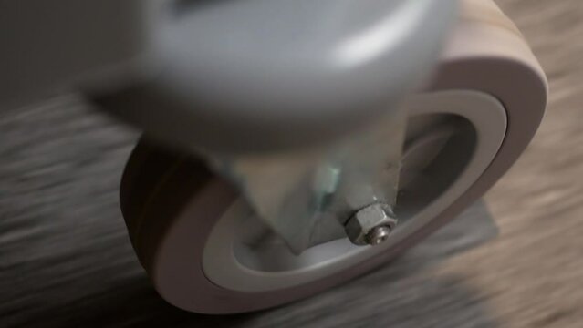 Close-up of the wheel of a guest luggage trolley in a hotel. top view