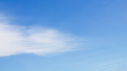Blue sky with white cirrus cloud on a clear day, soft sky panorama background