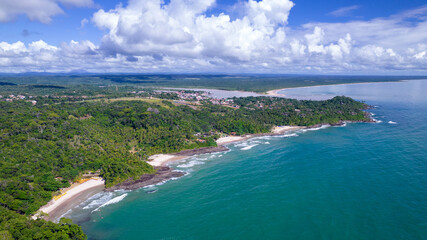Fototapeta na wymiar Aerial view of the beaches of Itacare, Bahia, Brazil. Small beaches with forest in the background and sea with waves